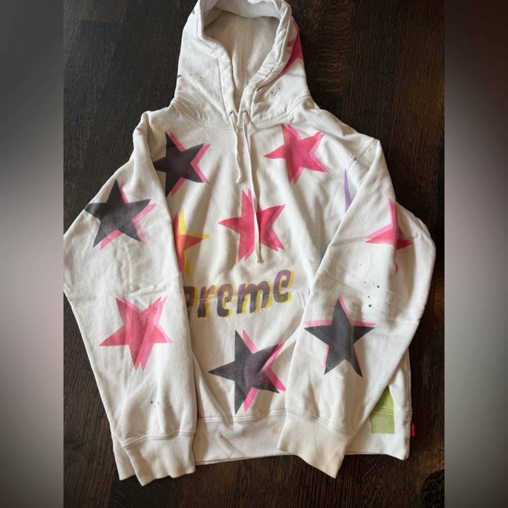Supreme Cream Hoodie with Pink Accent and Green Tag